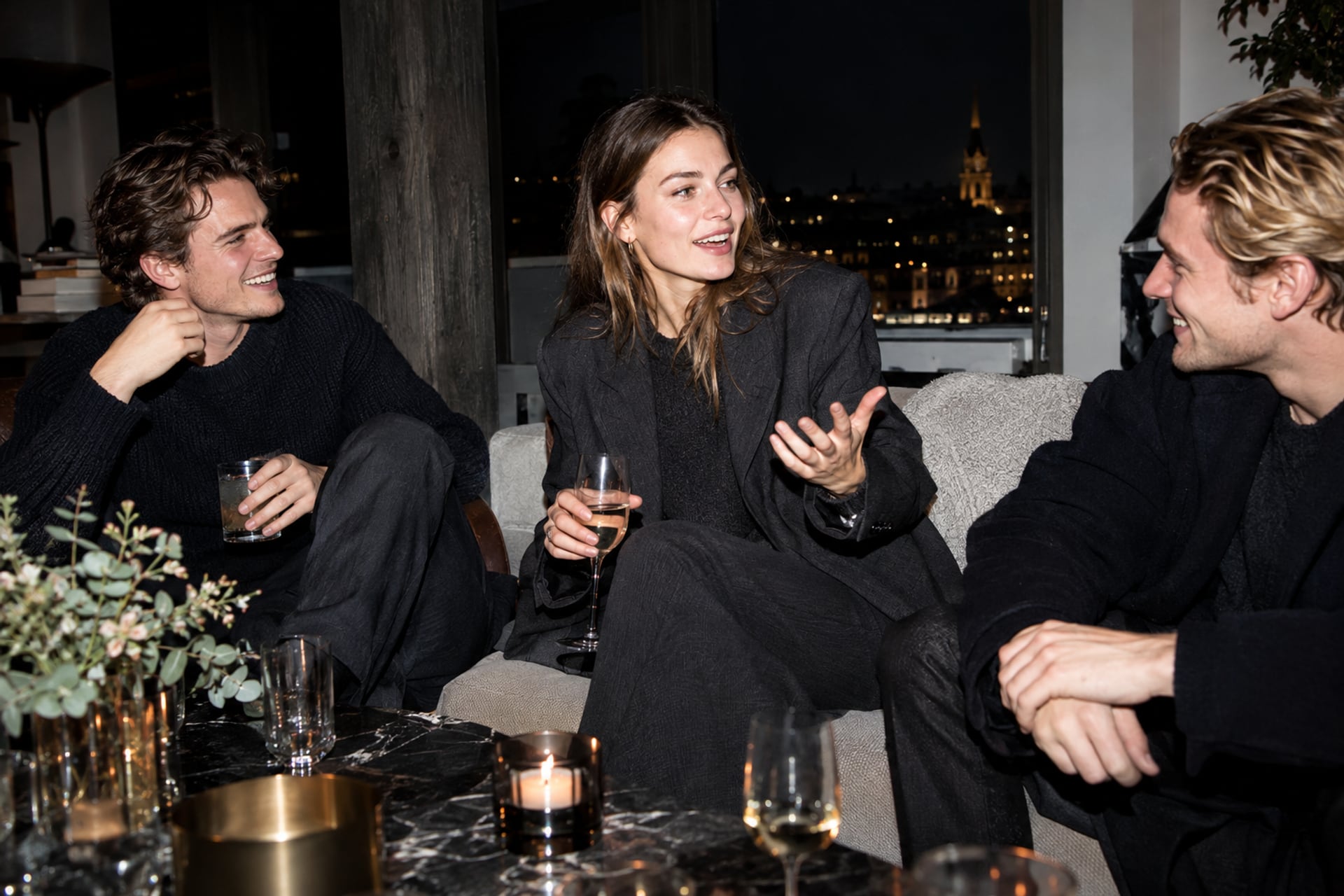 Founders exchange questions at a Stockholm loft gathering after dark.